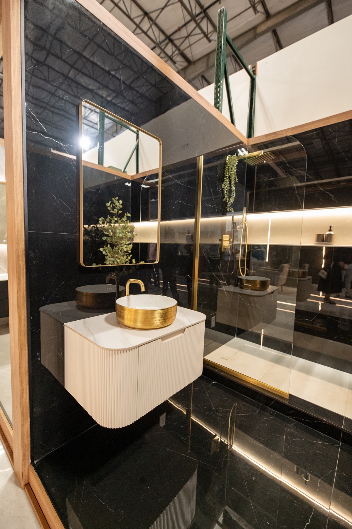 Black porcelain bathroom display with gold fixtures