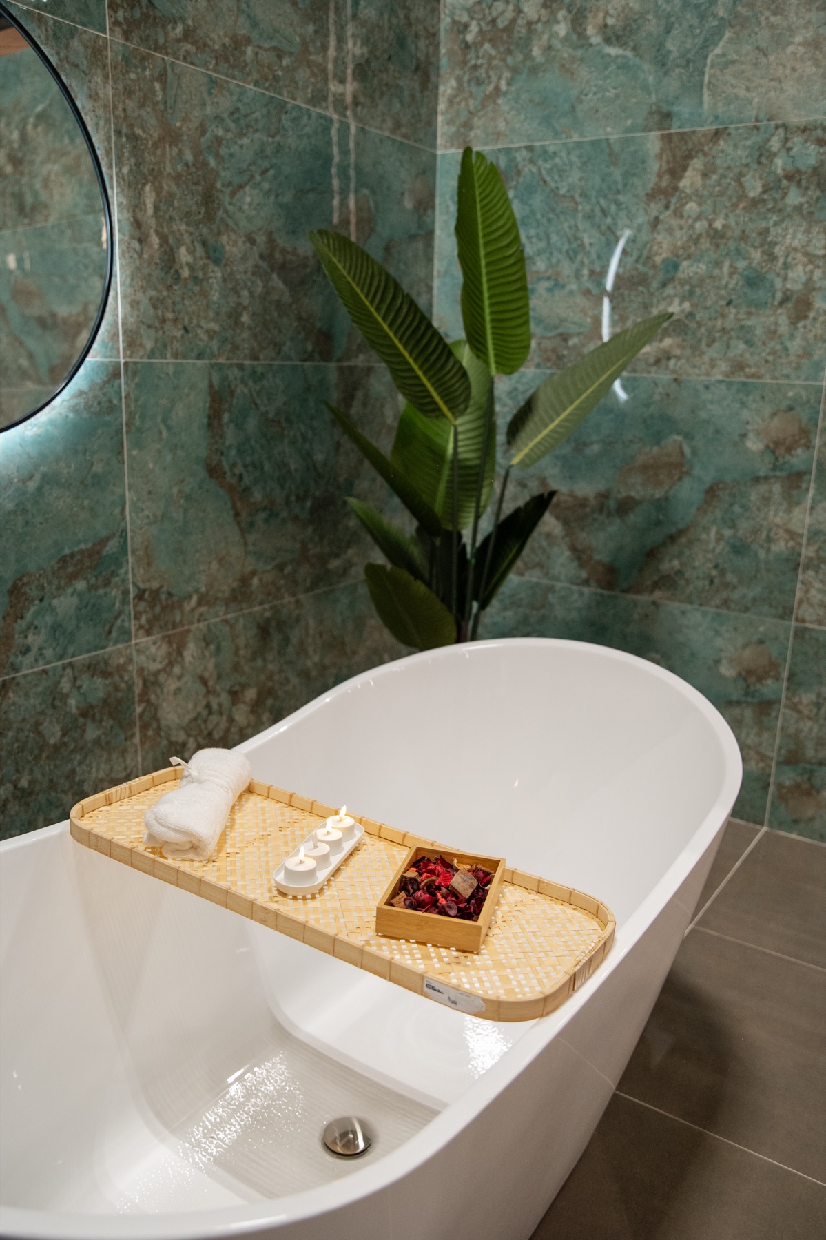Green porcelain tile and bathtub detail